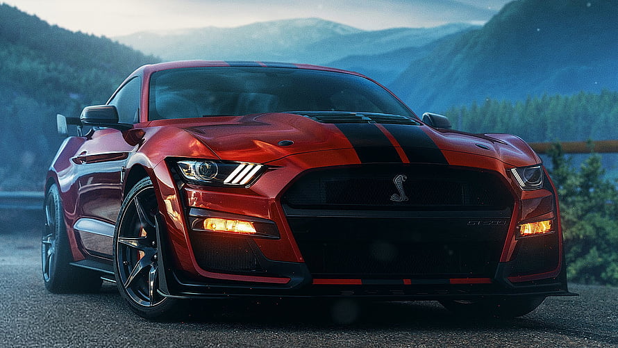 Red Ford Mustang Shelby GT500 with Black Racing Stripes on Mountain Road HD wallpaper