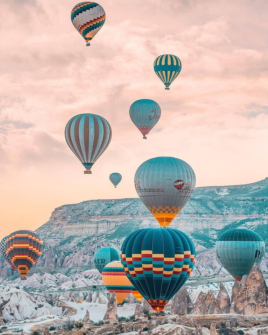 Colorful Hot Air Balloons Floating Over Cappadocia Rock Formations at Sunrise HD phone wallpaper