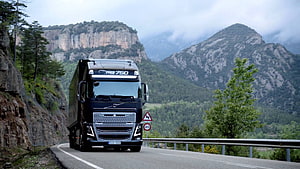 Volvo FH16 750 Heavy Duty Truck Driving on a Scenic Mountain Road HD wallpaper