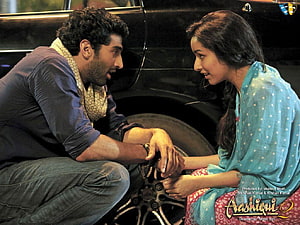 Aashiqui 2 Movie Scene: Man and Woman Sharing an Intimate Moment by a Car HD wallpaper