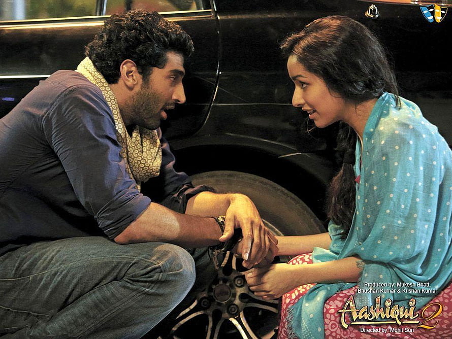 Aashiqui 2 Movie Scene: Man and Woman Sharing an Intimate Moment by a Car HD wallpaper