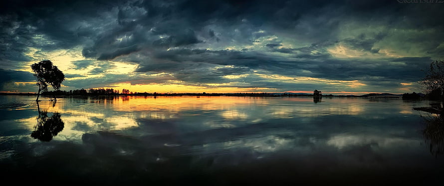 Dramatic Everglades Sunset with Stormy Clouds and Water Reflections HD wallpaper