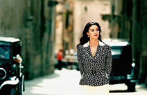 Monica Bellucci in Malena Movie Scene on a Sunlit Street HD wallpaper