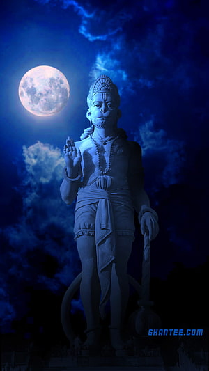 Lord Hanuman Statue Under a Glowing Full Moon in a Deep Blue Night Sky HD phone wallpaper