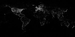 Illuminated World Map at Night with City Lights on Black Background HD wallpaper