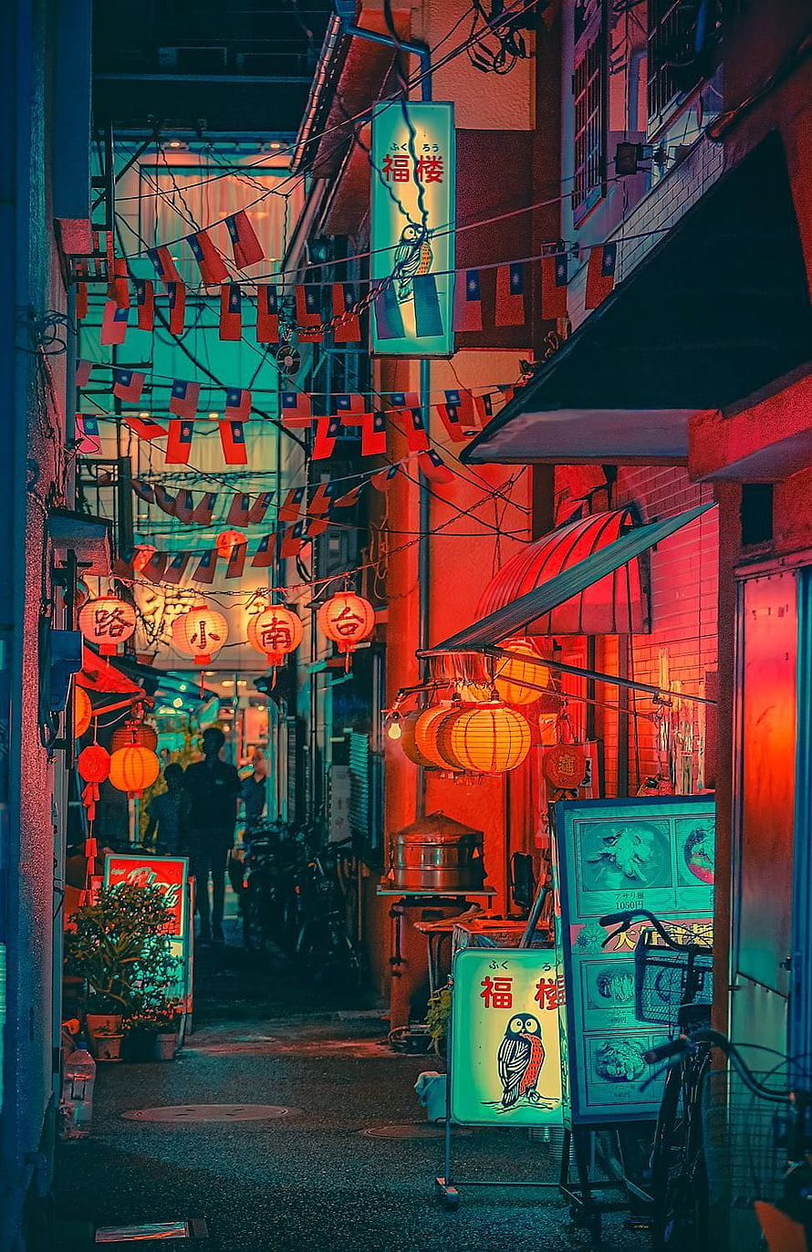 Neon-lit alley in Yokohama Chinatown with red lanterns and Japanese signage at night HD phone wallpaper