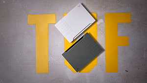ASUS TUF Gaming Laptop Product Showcase on Concrete Surface HD wallpaper
