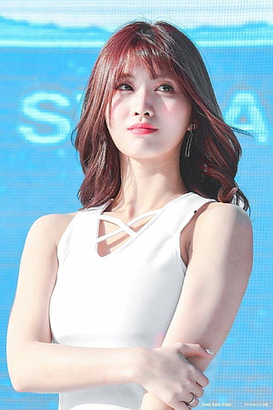 Hirai Momo from TWICE in a white strappy top with a blue LED backdrop HD phone wallpaper