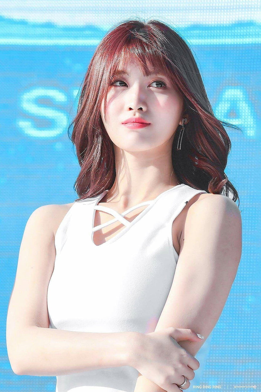 Hirai Momo from TWICE in a white strappy top with a blue LED backdrop HD phone wallpaper