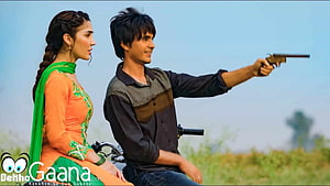 Couple Riding Motorcycle in Open Field with Pistol HD wallpaper