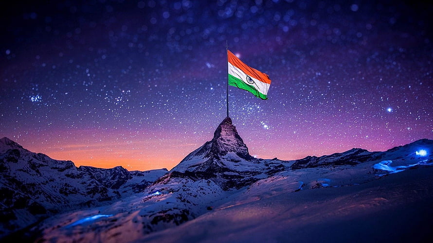 Indian National Flag Flying on Snowy Mountain Peak Under Starry Night Sky HD wallpaper