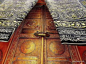 Ornate Golden Kaaba Door with Intricate Islamic Calligraphy and Embroidered Black Cloth HD wallpaper