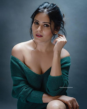 Archana Gupta in an emerald green off-shoulder knit sweater studio portrait HD phone wallpaper