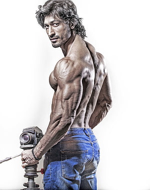 Vidyut Jammwal Muscular Physique Portrait with Vintage Camera HD phone wallpaper