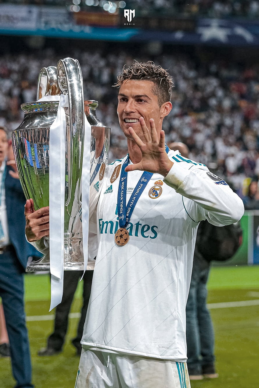Cristiano Ronaldo Celebrates Champions League Victory Lifting Trophy in Real Madrid Kit HD phone wallpaper