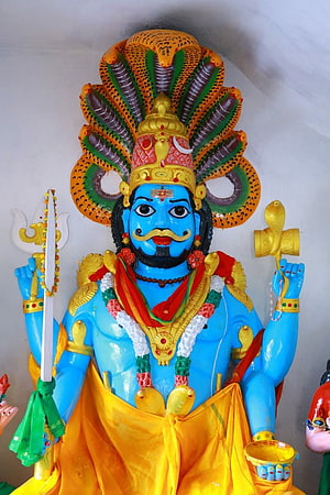 Lord Mallanna Swamy Murti with Serpent Crown and Traditional Offerings HD phone wallpaper