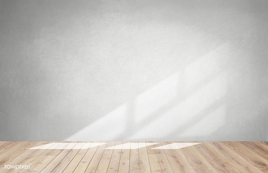 Minimalist empty room interior with gray wall and wooden floor bathed in soft natural sunlight HD wallpaper