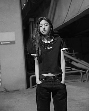 Go Yoon Jung in a Black and White Portrait Wearing a Ringer T-Shirt and Dark Jeans HD phone wallpaper