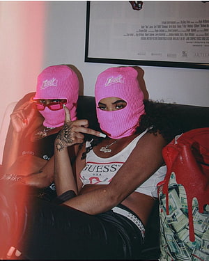 Two women in pink ski masks posing with red sunglasses and a Guess tank top HD phone wallpaper