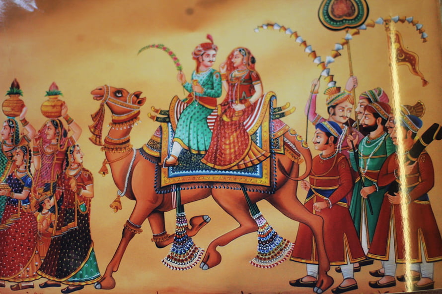 Traditional Rajasthani Folk Art Depicting Royal Couple on Decorated Camel HD wallpaper