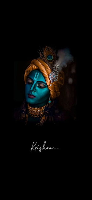 Lord Krishna Portrait with Peacock Feather Crown and Turquoise Face Paint HD phone wallpaper