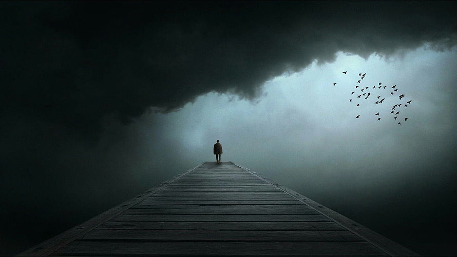 Lone figure walking on a wooden pier into dark storm clouds with a flock of birds HD wallpaper