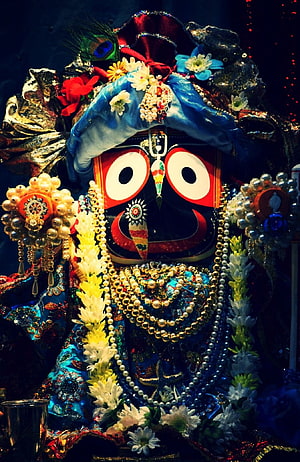Ornate Jagannatha Deity Adorned With Pearls, Flowers, And Traditional Temple Jewelry HD phone wallpaper