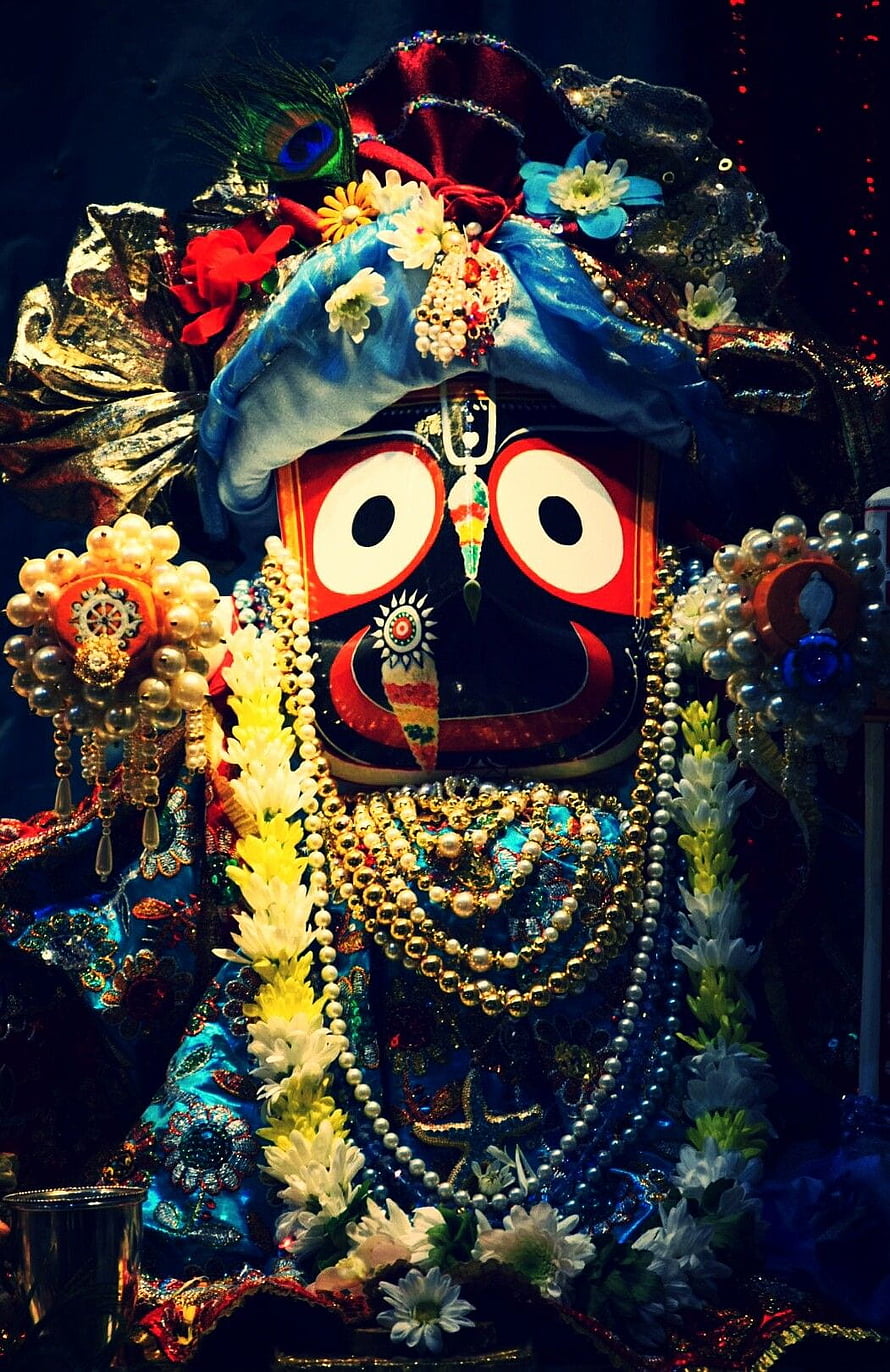 Ornate Jagannatha Deity Adorned With Pearls, Flowers, And Traditional Temple Jewelry HD phone wallpaper