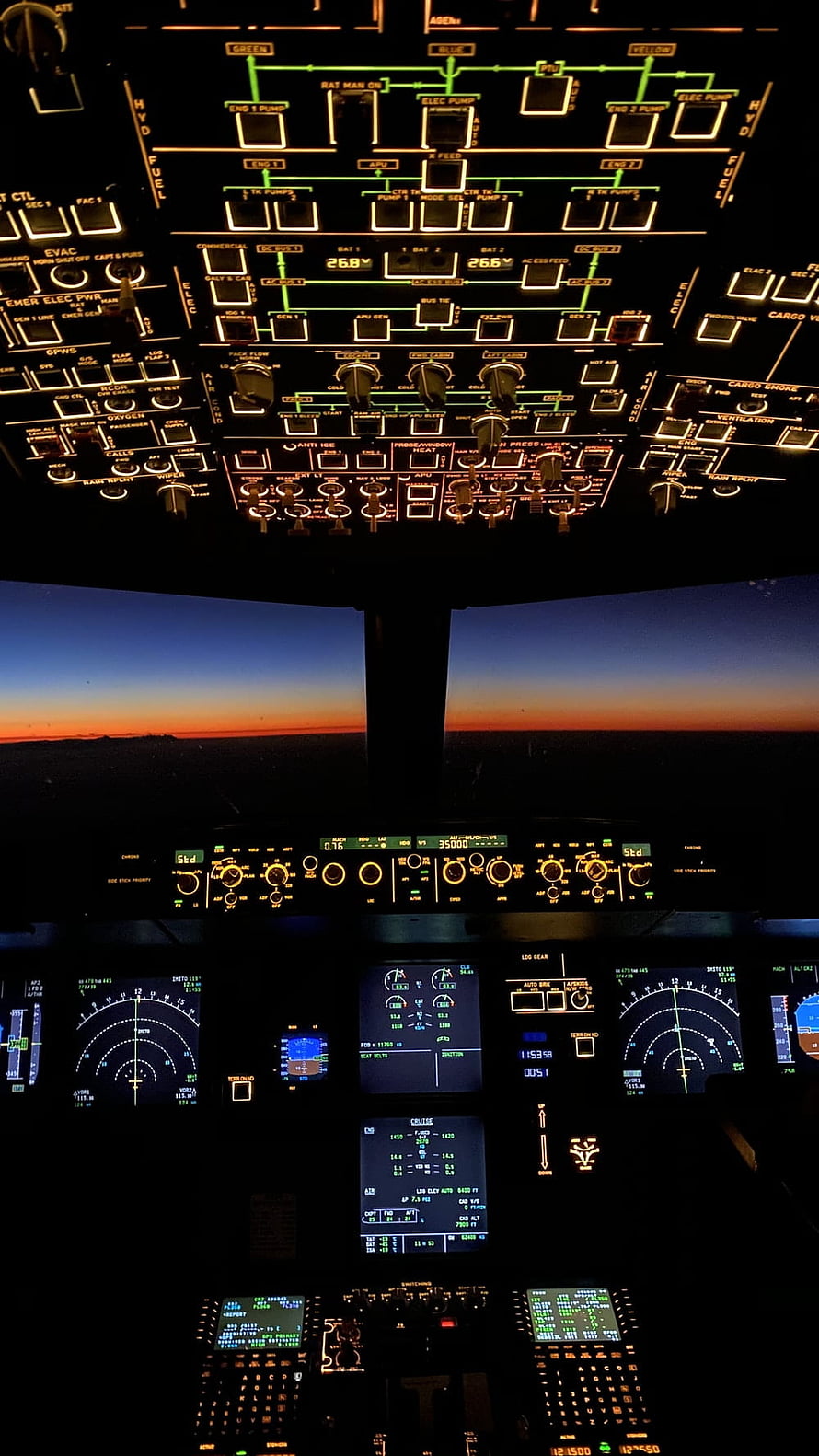 Airplane Cockpit View at Sunset with Illuminated Flight Instruments and Control Panels HD phone wallpaper