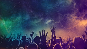 Silhouetted Worship Crowd With Raised Hands Under a Vibrant Starry Night Sky HD wallpaper