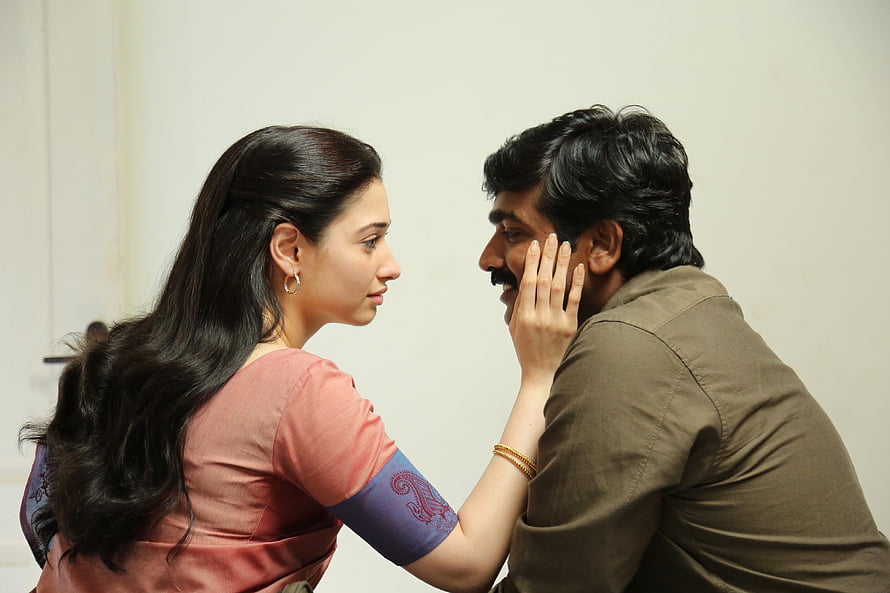 Dharmadurai Movie Still: Intimate Moment Between Lead Actors HD wallpaper