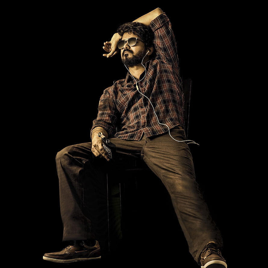 Thalapathy Vijay in a moody studio portrait wearing sunglasses and a plaid shirt HD phone wallpaper