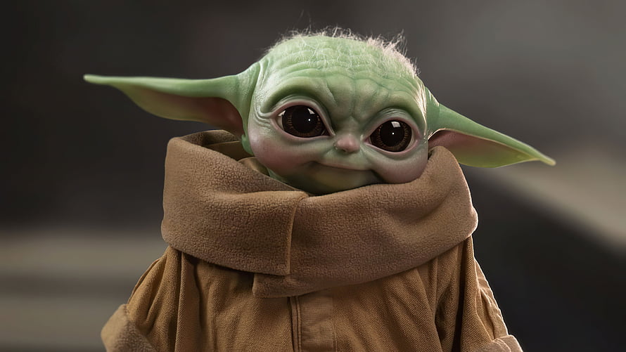 Grogu from The Mandalorian in a brown robe with large expressive eyes and pointed ears HD wallpaper
