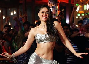 Kareena Kapoor in a sparkling silver two-piece outfit performing on stage with a cheering crowd HD wallpaper