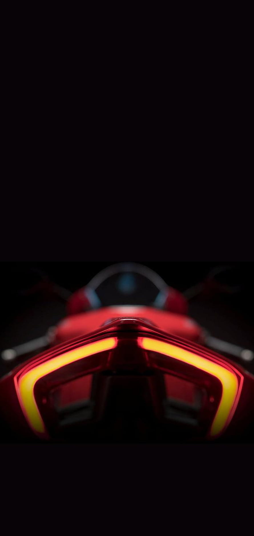 Ducati Panigale V4 Rear View with Glowing Red Taillight in Dark Setting HD phone wallpaper