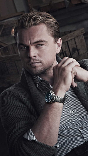 Leonardo DiCaprio in a moody portrait wearing a wristwatch and checkered shirt HD phone wallpaper