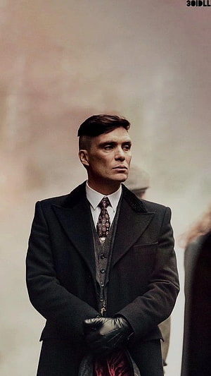 Tommy Shelby in a dark overcoat and leather gloves from Peaky Blinders HD phone wallpaper