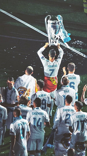 Real Madrid Players Celebrate Champions League Victory with Trophy Lift HD phone wallpaper