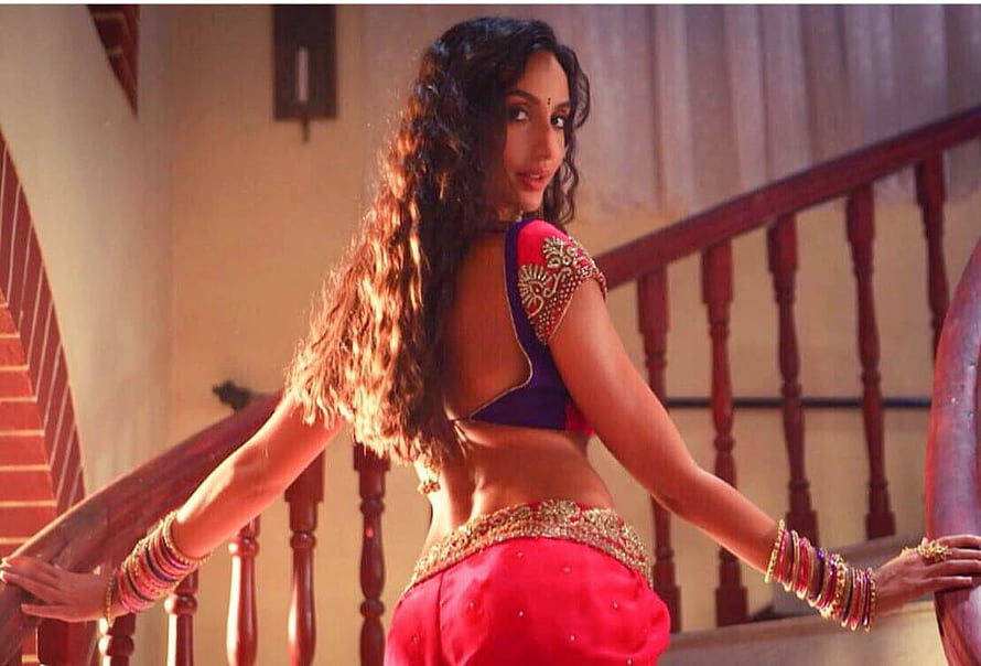 Nora Fatehi in Traditional Indian Attire on a Wooden Staircase HD wallpaper