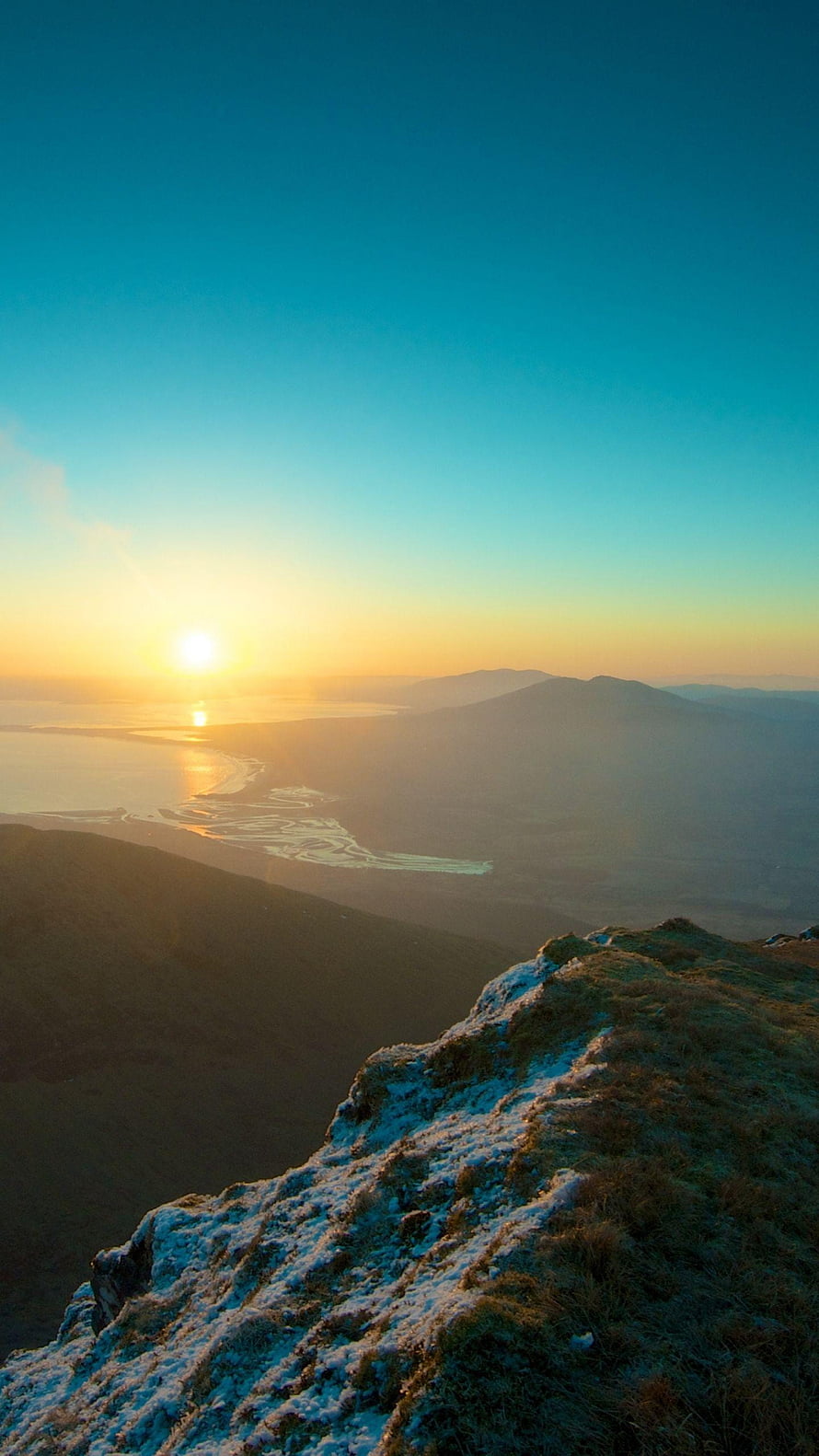 Sunrise Over Snowy Mountain Ridge and Coastal River Delta Landscape HD phone wallpaper