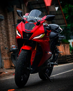 Red KTM RC 150 V4 Sport Motorcycle Parked on Wet Street HD phone wallpaper