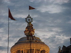 Jagannath Temple Puri Dome With Dharma Chakra And Flags Against Cloudy Sky HD wallpaper