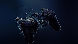 Shattered PlayStation Controller Exploding in Dark Space HD wallpaper