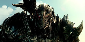 Megatron from Transformers The Last Knight with glowing red eyes and dark metallic armor HD wallpaper