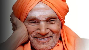 Portrait of Siddaganga Swamiji Wearing an Orange Turban and Smiling HD wallpaper