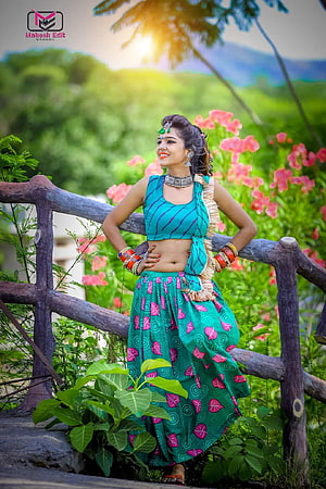 Hansha Rangili in Traditional Green Attire Posed in Lush Garden HD phone wallpaper