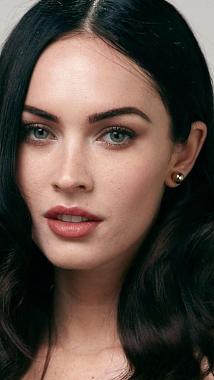 Megan Fox Close-Up Portrait with Dark Hair and Gold Earrings HD phone wallpaper