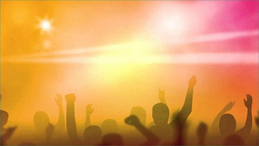 Silhouetted Worship Crowd With Raised Hands Against Vibrant Sunset Sky HD wallpaper