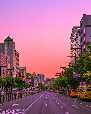 Vibrant Seoul Street Scene at Dusk with Crescent Moon and Pink Sky HD phone wallpaper