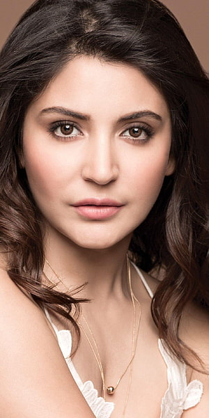 Anushka Sharma Elegant Portrait with Soft Lighting and Delicate Gold Necklace HD phone wallpaper
